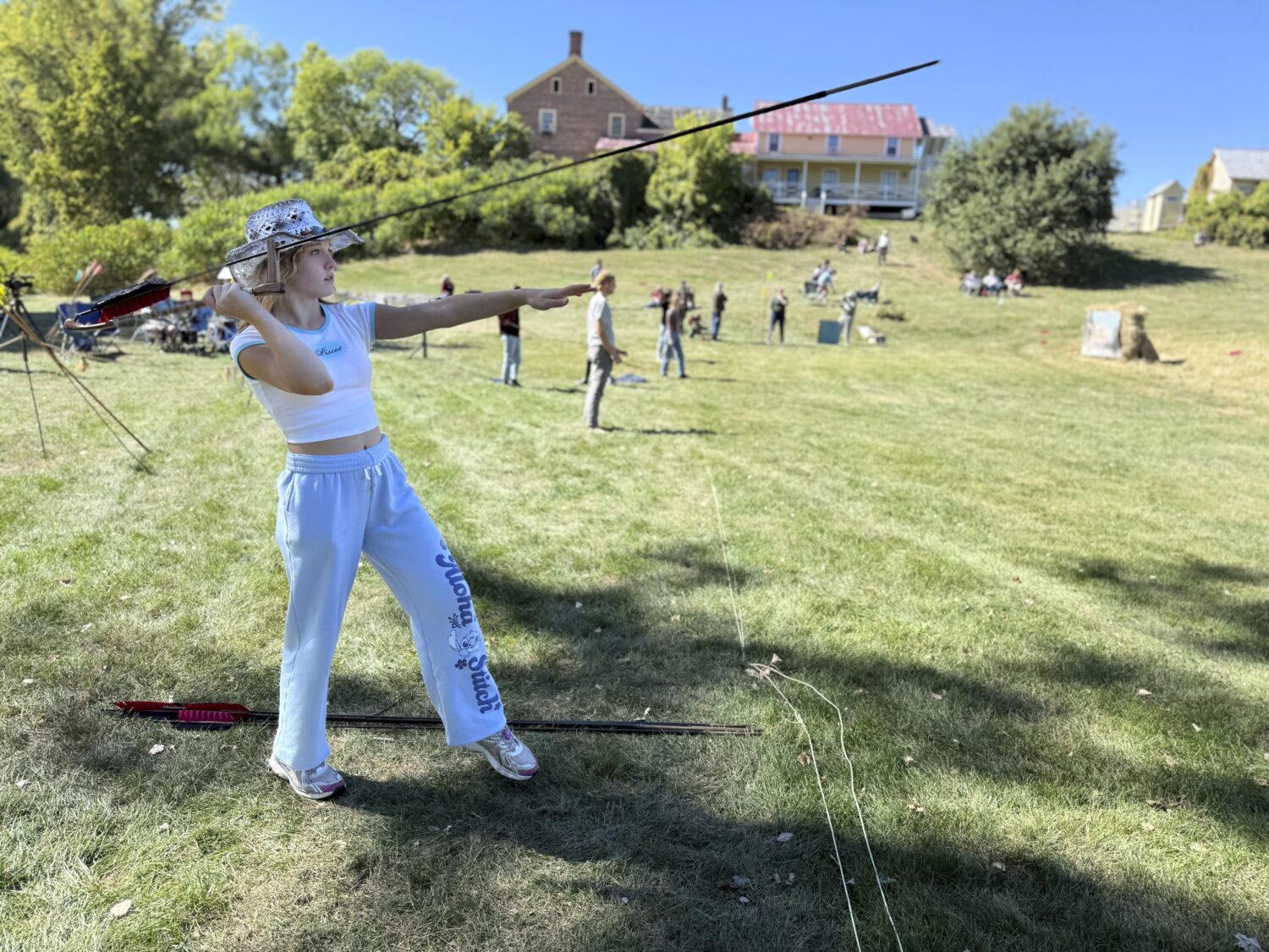 12-year-old Ava Nolf of Clinton, Connecticut practices throwing an atlatl during the Northeastern A...