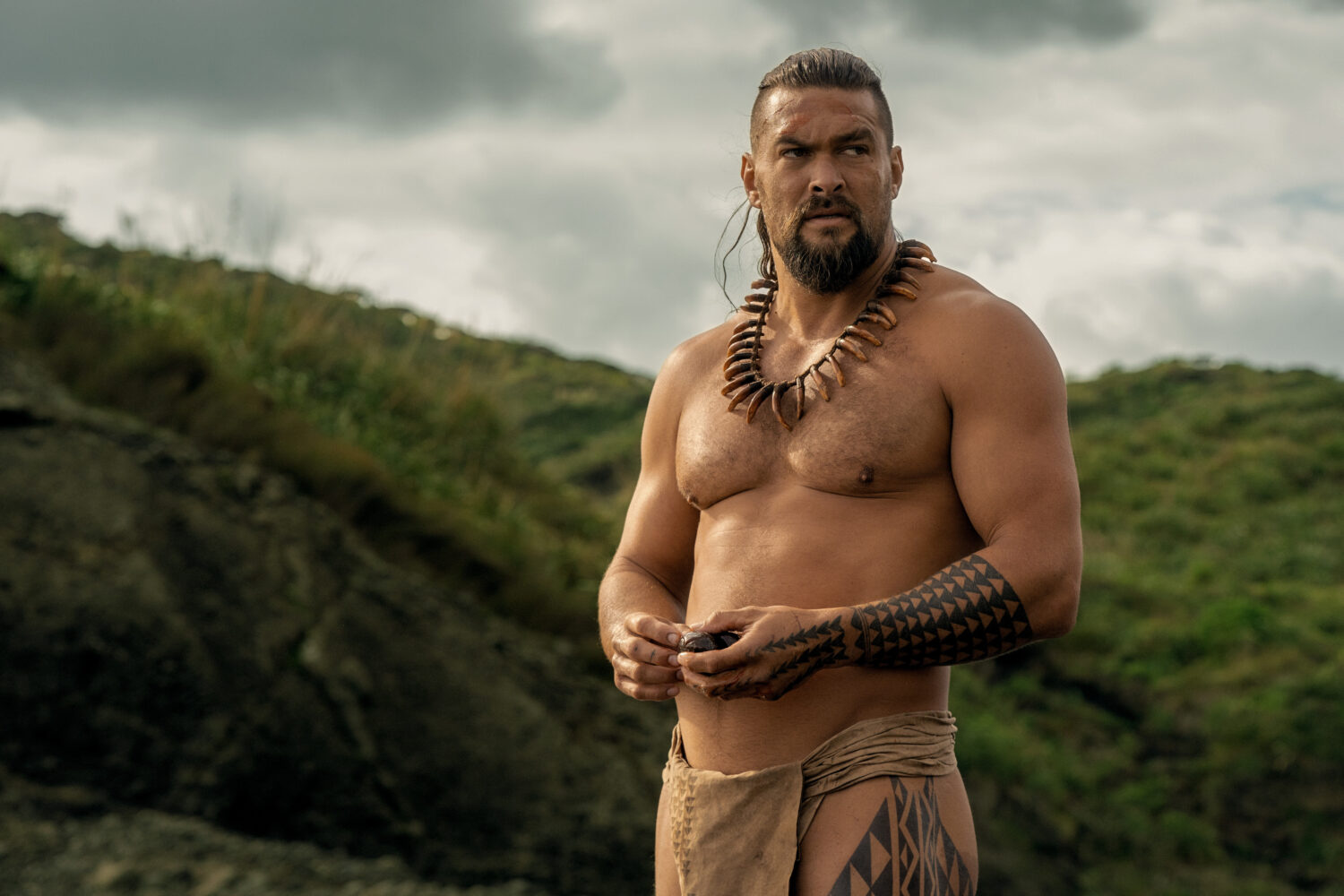 This image released by Apple TV+ shows Jason Momoa in a scene from "Chief of War." (Apple TV+ via A...