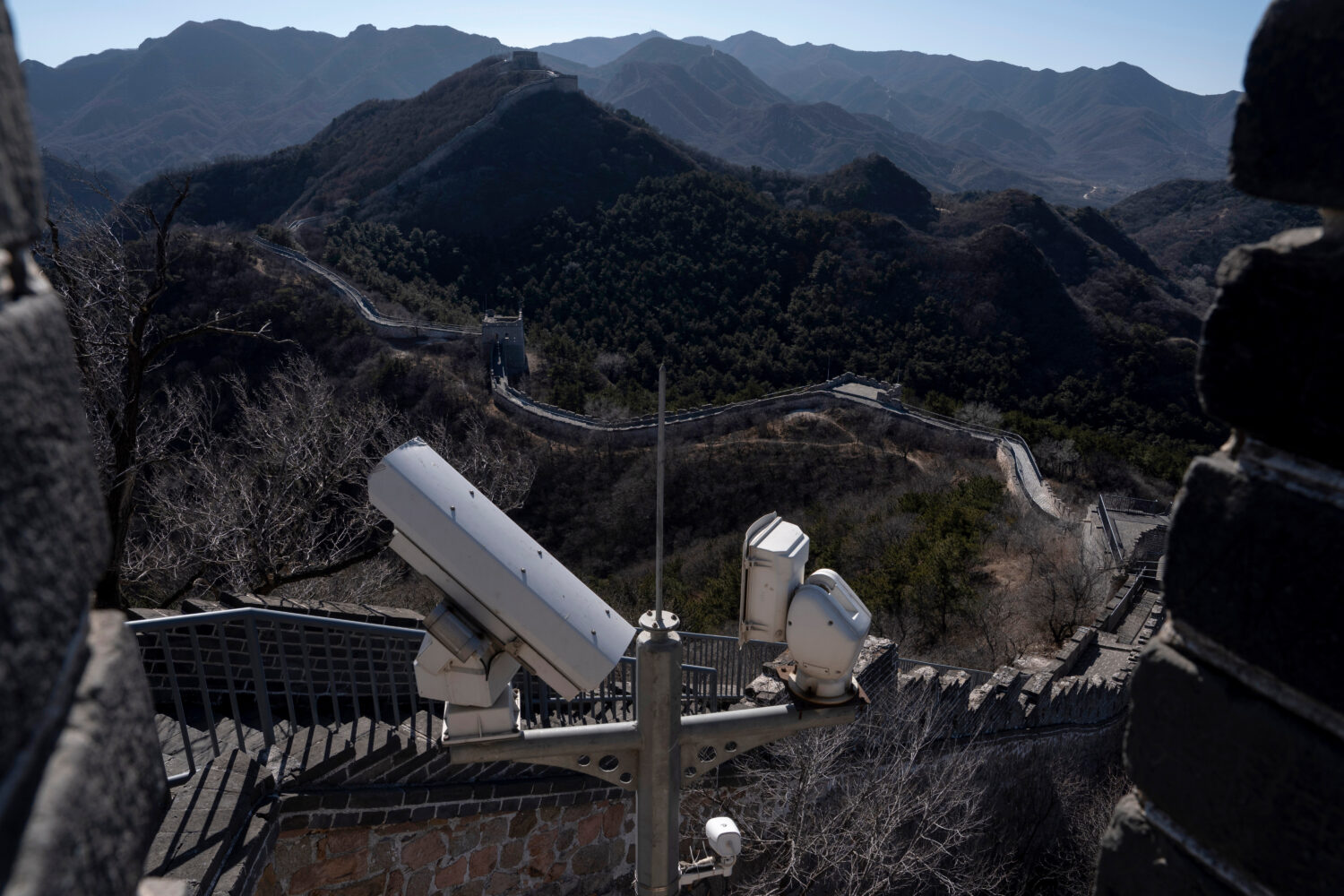 Security cameras are positioned on the Great Wall of China on the outskirts of Beijing, Tuesday, Fe...