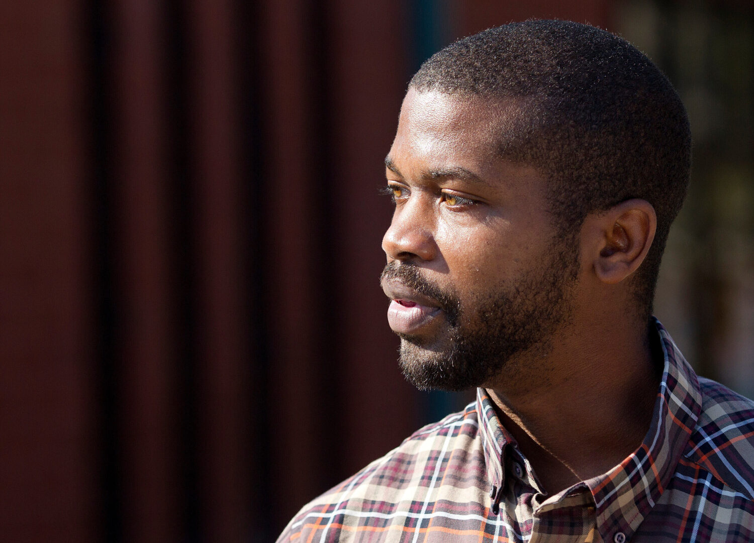 CORRECTS SOURCE TO NEWS&RECORD = N.C. House Rep. Cecil Brockman talks with early voters at Brown Re...