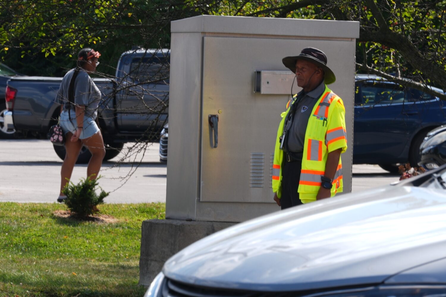 School crossing guard Anthony Taylor operates a traffic control box, Wednesday, Sept. 3, 2025, in I...