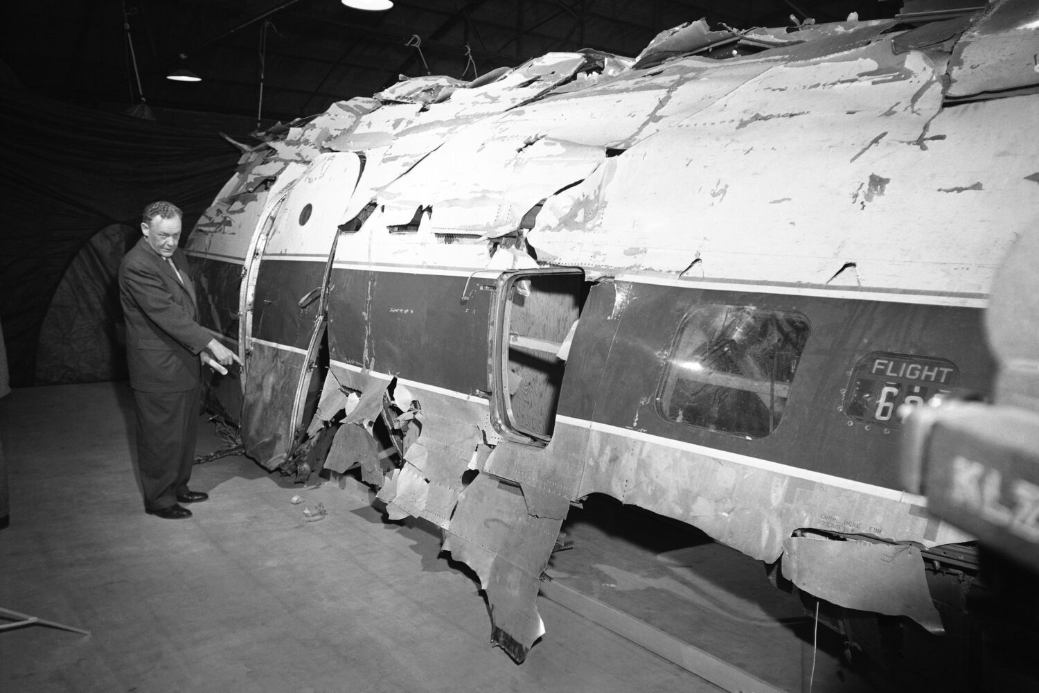 FILE - United Airlines official W.C. Mentzer stands in front of the United Airlines plane which Joh...