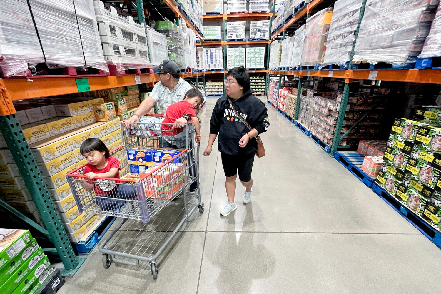 KC Neufeld, right, shops with her family in Englewood, Colo., Wednesday, Oct. 29, 2025.Credit: ASSO...