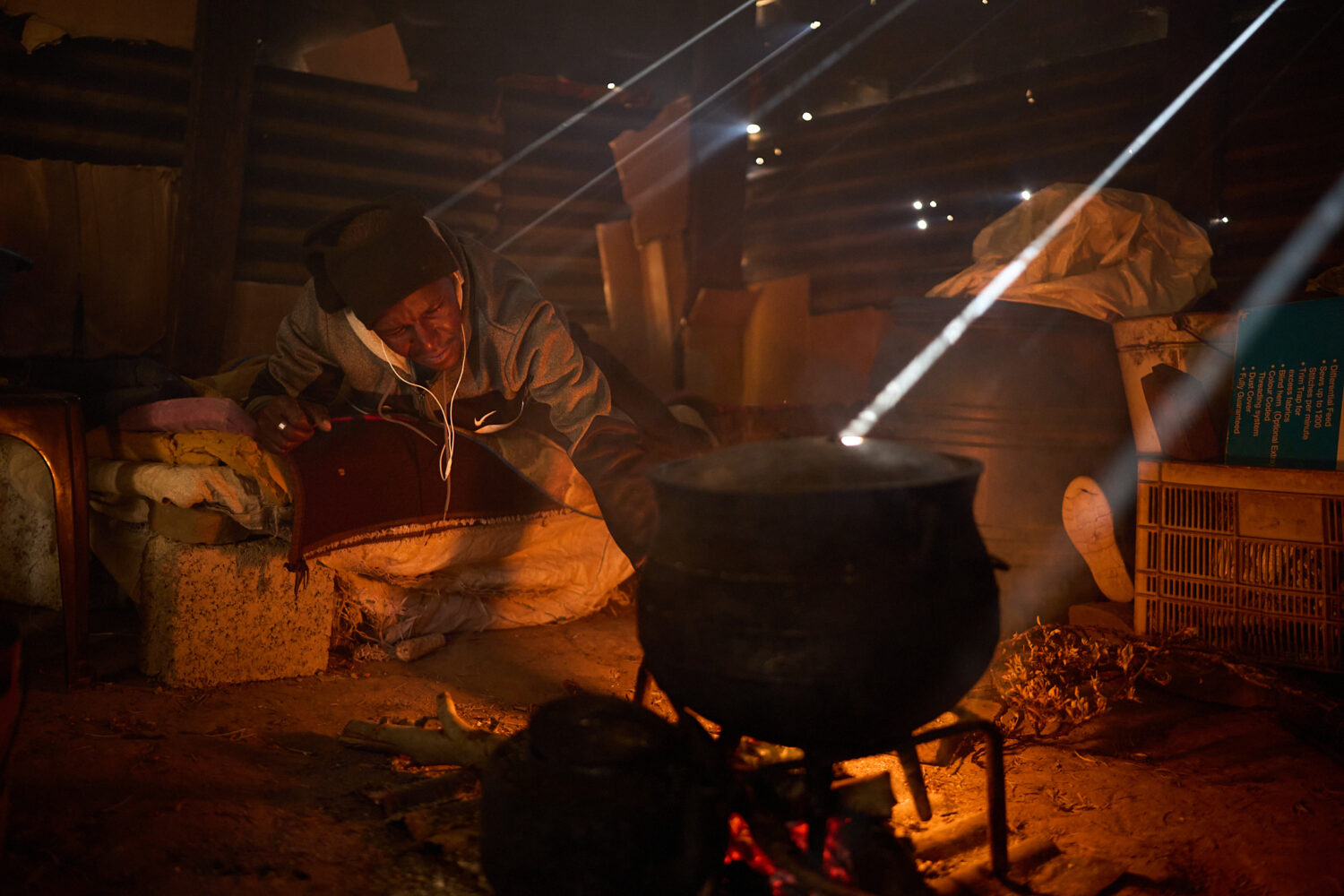 FILE - Matli Monyamane cooks a meal in Ha Lejone, Lesotho, July 22, 2025. (AP Photo/Bram Janssen, F...