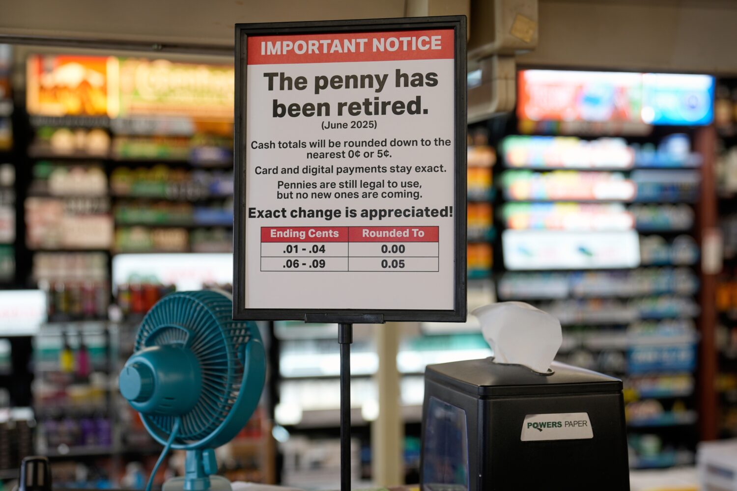A sign in a Kwik Trip store shows the store will no longer be using pennies to give change, on Oct....