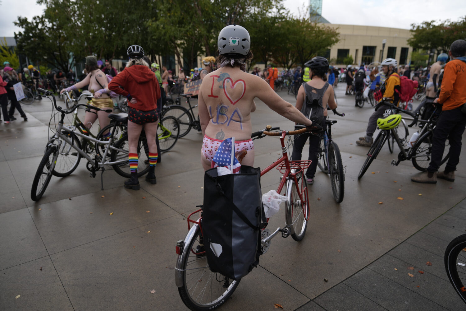 Participants prepare for the Naked Bike Ride protest on Sunday, Oct. 12, 2025, in Portland, Ore. (A...