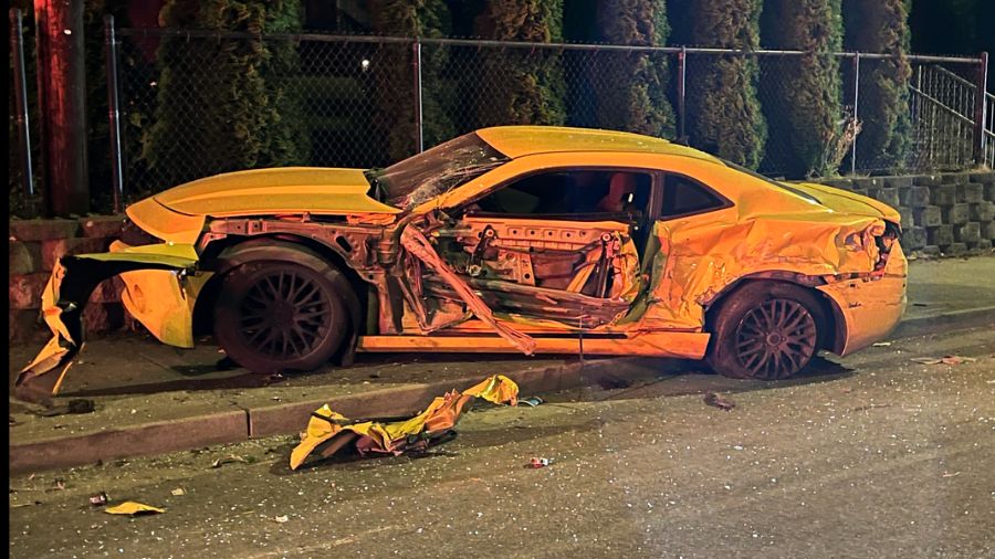 This Chevy Camaro was one of more than a dozen vehicles damaged in a destructive rampage by a suspect in a stolen Everett fire truck. (Photo: Everett Fire Dept.)