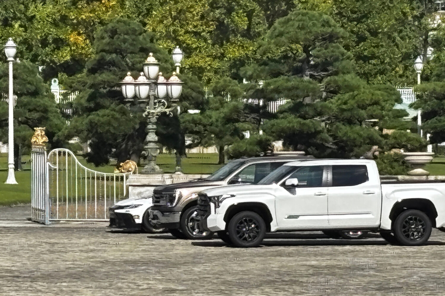 A Ford F-150, center, and two other American-made cars sit parked outside the Akasaka Palace, Tokyo...