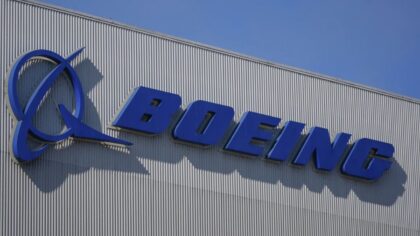 Boeing narrows loss in quarterly earnings as airplane deliveries surge