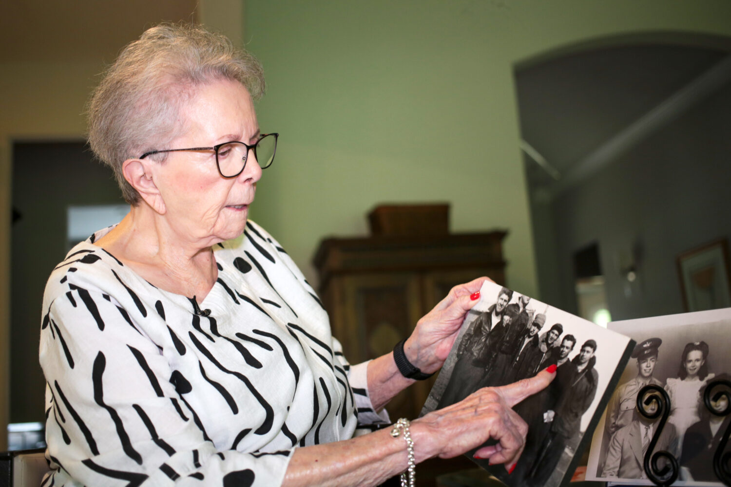 June West Brandt, 93, holds a photo displaying her brother, William Durham West Jr., who was killed...