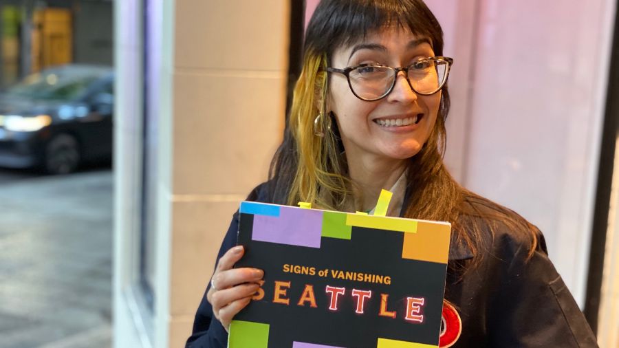Vanishing Seattle founder Cynthia Brothers, photographed in the doorway of the old Coliseum Theatre...